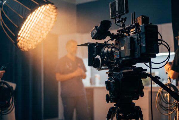 Clinician filmed on set with cinema camera and lights for healthcare video marketing and training.