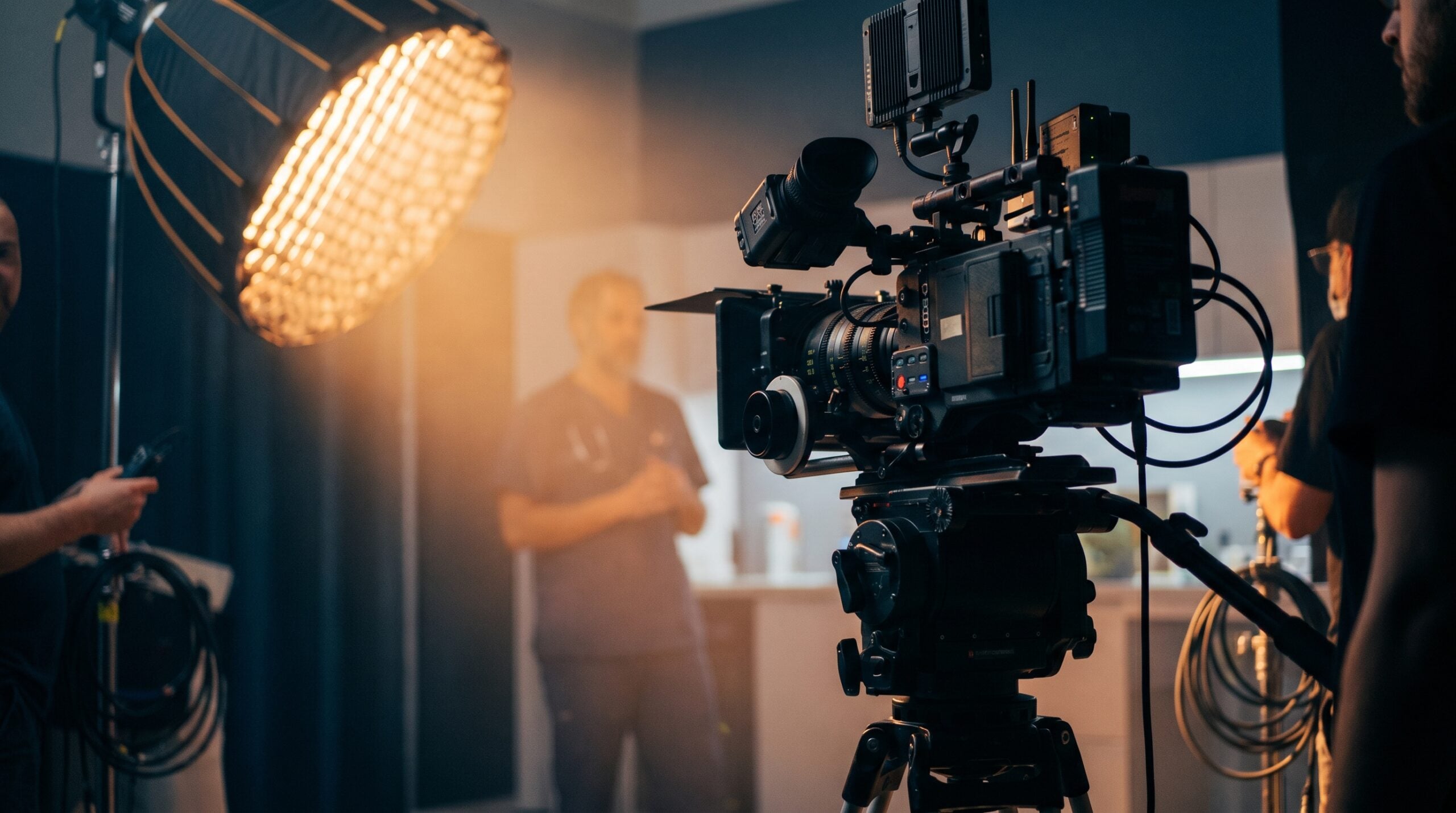 Clinician filmed on set with cinema camera and lights for healthcare video marketing and training.