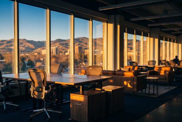 Modern marketing office for healthcare paid ads in Boise featuring large windows with golden hour views of the foothills.
