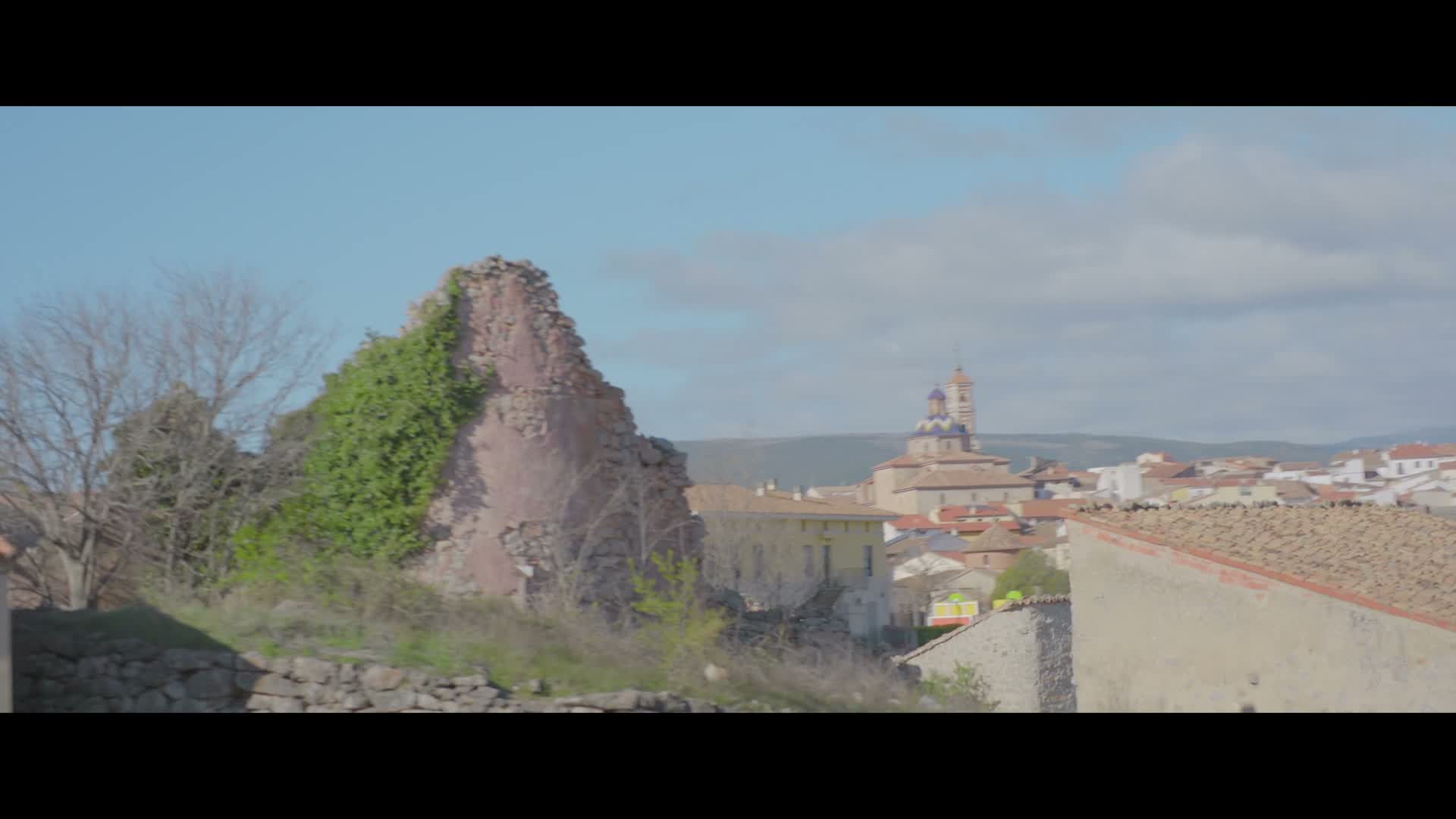 A hilltop Spanish town at golden hour, where the truffles grow